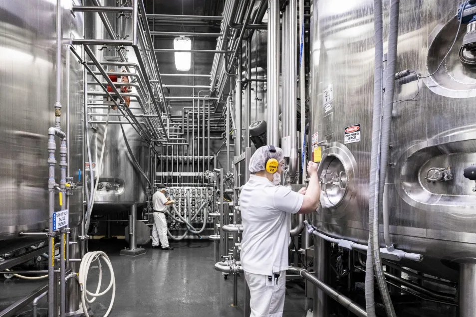 Galloway employee inspecting machine